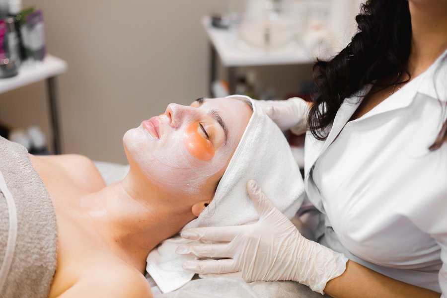Woman with radiant skin after regular LED and peel treatments